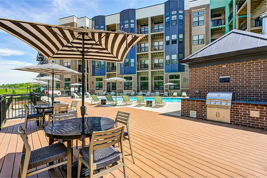 Outdoor seating area and grilling station at East Bank Apartments in Noblesville